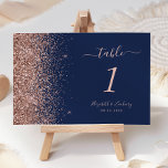 Modern Navy Blue Rose Gold Glitter Wedding Table Number<br><div class="desc">The left-hand edge of this elegant modern wedding table number features a rose gold faux glitter design. The customisable text combines rose pink handwriting,  copperplate and italic fonts on a navy blue background.</div>