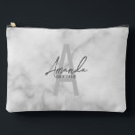 Modern Personalised Bridesmaid's Monogram and Name Accessory Pouch<br><div class="desc">Modern Personalised Bridesmaid's Monogram and Name Gifts This design features personalised bridesmaid's name in grey modern handwriting script font style and monogram in light grey modern sans serif font style as background, with wedding details in grey modern sans serif font style, on white marble background. Also perfect for maid of...</div>