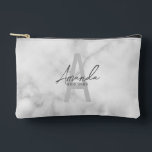 Modern Personalised Bridesmaid's Monogram and Name Accessory Pouch<br><div class="desc">Modern Personalised Bridesmaid's Monogram and Name Gifts This design features personalised bridesmaid's name in grey modern handwriting script font style and monogram in light grey modern sans serif font style as background, with wedding details in grey modern sans serif font style, on white marble background. Also perfect for maid of...</div>