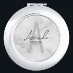 Modern Personalised Bridesmaid's Monogram and Name Compact Mirror<br><div class="desc">Modern Personalised Bridesmaid's Monogram and Name Gifts This design features personalised bridesmaid's name in grey modern handwriting script font style and monogram in light grey modern sans serif font style as background, with wedding details in grey modern sans serif font style, on white marble background. Also perfect for maid of...</div>