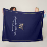 Modern Personalised Newlywed Keepsake Monogram Fleece Blanket<br><div class="desc">Modern Chic Navy Blue Personalised Newlyweds Keepsake Monogram Fleece Blanket. Personalised navy blue and gold monogrammed fleece blanket. Stylish classic script for the initial, the names of the bride and groom, and the wedding date on a simple elegant navy blue background. Perfect wedding gift for newly weds, a cherished reminder...</div>