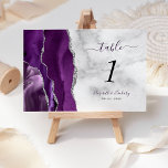 Modern Purple Silver Agate Marble Wedding Table Number<br><div class="desc">The left-hand edge of this elegant modern wedding table number card features a purple watercolor agate border trimmed with faux silver glitter. The customisable text combines dark purple handwriting script with black italic and copperplate fonts on a grey and white marble background.</div>