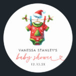 Modern Red Holly Christmas Santa Baby Shower Classic Round Sticker<br><div class="desc">Enhance your holiday baby shower with our Modern Red Holly Christmas Santa Baby Shower Classic Round Sticker. Featuring a festive Santa Claus design on a vibrant red background, this sticker is adorned with holly and winter greenery, adding a cheerful touch to your event. Perfect for sealing envelopes, decorating favour bags,...</div>