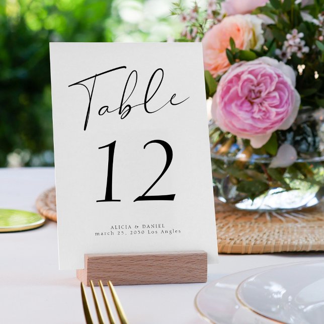 Modern script elegant black and white wedding table number (Creator Uploaded)