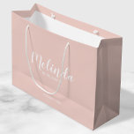 Modern Script Personalised Bridesmaids Large Gift Bag<br><div class="desc">Modern Script Personalised Bridesmaids Gift Bag
featuring personalised bridesmaid's name in white modern script font style with title and wedding date in modern sans serif font style on blush pink background.

Also perfect for Maid of Honour,  Flower Girl,  Mother of the Bride and more.</div>