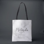Modern Script Personalised Bridesmaids Tote Bag<br><div class="desc">Modern Script Personalised Bridesmaids Tote Bag
featuring personalised bridesmaid's name in grey modern script font style with title and wedding date in modern sans serif font style on white marble background.

Also perfect for Maid of Honour,  Flower Girl,  Mother of the Bride and more.</div>