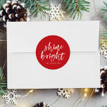 Modern Shine Bright Script Red Holiday Classic Round Sticker<br><div class="desc">Add a festive touch to your holiday envelopes and gift boxes with our Shine Bright holiday stickers. The custom holiday stickers feature the words "Shine Bright" in a white,  modern hand-lettered script and a red background. Personalise the stickers by adding your name or custom text below.</div>