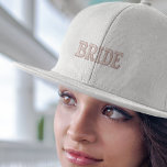 Modern Simple Pink Bride Typography Engagement Embroidered Hat<br><div class="desc">This baseball cap features a sleek and modern design with pink typography that adds a stylish flair. The embroidered details give it a high-quality finish, making it an elegant choice for any occasion. Whether you're celebrating your engagement or enjoying your honeymoon, this cap will make you feel like the centre...</div>