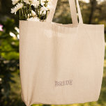 Modern Simple Pink Bride Typography Engagement Embroidered Tote Bag<br><div class="desc">This tote bag features a sleek and modern design with pink typography that adds a stylish flair. The embroidered details give it a high-quality finish, making it an elegant choice for any occasion. Whether you're celebrating your engagement or enjoying your honeymoon, this bag will make you feel like the centre...</div>