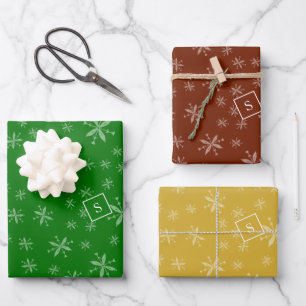 Modern Snowflake Pattern Monogrammed Red and Green Wrapping Paper Sheet