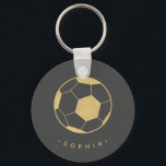 Modern Soccer in Black and Gold Personalised Key Ring<br><div class="desc">The soccer player or soccer fan in your life will love these personalised keychains featuring a gold soccer ball. Perfect as a party favour. Coordinates with Parcel Studio's Soccer Star collection. Background colour and text is customisable. *Note: The gold in this product is simulated. No actual gold will be used...</div>