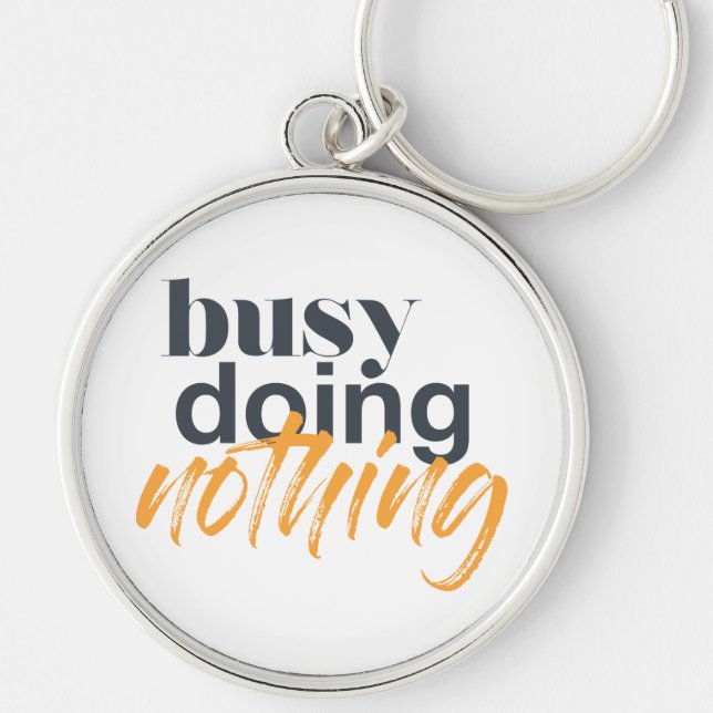 Modern, trendy, urban design of Busy Doing Nothing Key Ring (Front)
