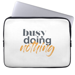Modern, trendy, urban design of Busy Doing Nothing Laptop Sleeve