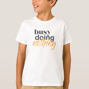 Modern, trendy, urban design of Busy Doing Nothing T-Shirt