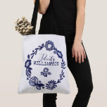 Modern Vintage Navy Blue & White Floral Wreath Tote Bag<br><div class="desc">Show off your own unique style with our expressive stylish tote bag design perfect for everyday use. The design features beautiful stylish modern florals and leaves combined together to create a beautiful circular wreath style family name and monogram tote bag. Change it up, simply flip the tote bag to display...</div>