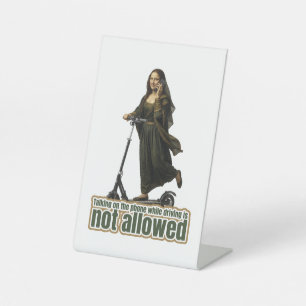 Mona Lisa on the phone riding a kick scooter Pedestal Sign