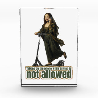 Mona Lisa on the phone  riding a kick scooter Photo Block