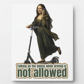 Mona Lisa on the phone  riding a kick scooter Plaque