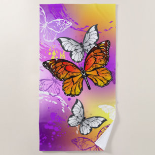 Monarch Butterflies on Purple Background Beach Towel