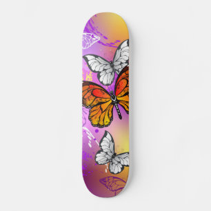 Monarch Butterflies on Purple Background Skateboard