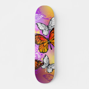 Monarch Butterflies on Purple Background Skateboard