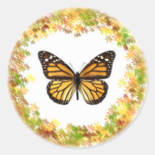 Monarch butterfly in frame of leaves classic round sticker