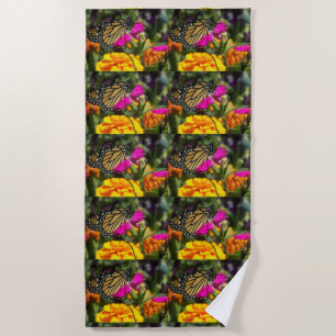 Monarch Butterfly on a pink marigold flower Beach Towel
