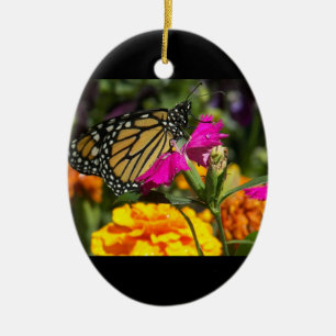 Monarch Butterfly on pink marigold-oval ornament