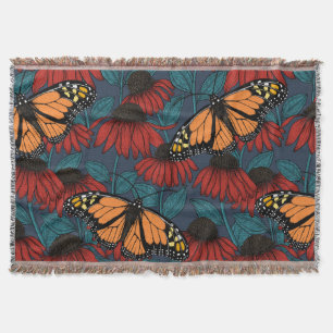 Monarch butterfly on red coneflowers throw blanket