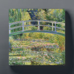 Monet Japanese Bridge with Water Lilies Plaque<br><div class="desc">Monet Japanese Bridge with Water Lilies plaque. Oil painting on canvas from 1899. Monet painted the Japanese style bridge above his water lily pond at Giverny multiple times throughout his long career. This is one of the most famous of Monet’s Japanese Bridge paintings. The work features the bridge at mid...</div>