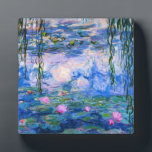 Monet Water Lilies Plaque<br><div class="desc">Monet Water Lilies plaque. Oil painting on canvas from 1916. Monet painted his famous water lily pond obsessively during the final years of his career, drawing inspiration from the light of the sun and its shifting effect on the water and the aquatic flowers and foliage. This painting features a vibrant...</div>