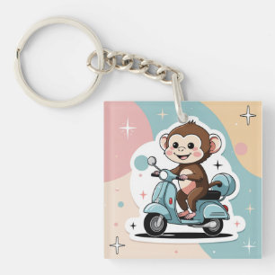 Monkey driving a scooter key ring