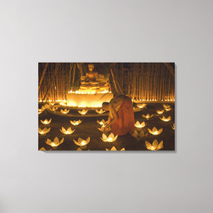 Monks lighting khom loy candles and lanterns for canvas print