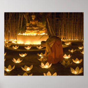 Monks lighting khom loy candles and lanterns for poster