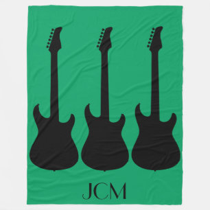 Monogram Black Electric Guitars on Green Fleece Blanket
