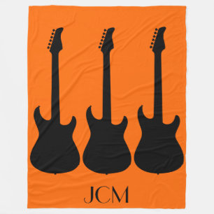 Monogram Black Electric Guitars on Orange Fleece Blanket