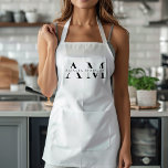 Monogram Black Minimal Apron<br><div class="desc">Elevate your kitchen style with this Monogram Black Minimalist Apron. Featuring a sleek and simple design, this apron combines functionality with elegance, making it perfect for both home cooks and professional chefs. The customisable monogram adds a personal touch, ensuring that you cook in style. Made from durable materials, this apron...</div>