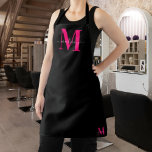 Monogram Bold Pink Initial & Black Stylish Minimal Apron<br><div class="desc">Add a touch of modern style to your kitchen attire with our Modern Clean Black & Bold Pink Monogram Initials Name Apron. This sleek black apron features striking bold pink monogram initials, offering both chic design and personalised flair. Elevate your cooking experience with this unique and fashionable apron, perfect for...</div>