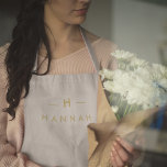 Monogram Gold Grey | Minimalist Elegant Modern Apron<br><div class="desc">A simple stylish custom monogram design in a gold modern minimalist typography on an elegant minimalist soft taupe grey background. The monogram initials and name can easily be personalised along with the feature line to make a design as unique as you are! The perfect bespoke gift or accessory for any...</div>