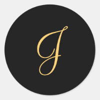Monogram J, gold coloured initial J on black,