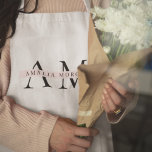 Monogram Minimal Initial Apron<br><div class="desc">Elevate your kitchen style with this Monogram Minimalist Apron. Featuring a sleek and simple design, this apron combines functionality with elegance, making it perfect for both home cooks and professional chefs. The customisable monogram adds a personal touch, ensuring that you cook in style. Made from durable materials, this apron is...</div>