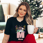 Monogram Personalised With Name Pink Christmas T-Shirt<br><div class="desc">Celebrate the holidays in style with the Monogram Personalised With Name Family Christmas T-Shirt, a perfect blend of festive cheer and personalisation. This custom family Christmas shirt features a monogram design paired with a chequered Christmas hat adorned with playful lights, making it a fun and festive choice for the entire...</div>