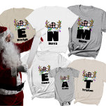 Monogram Personalised With Name Pink Christmas T-Shirt<br><div class="desc">Celebrate the holidays in style with the Monogram Personalised With Name Family Christmas T-Shirt, a perfect blend of festive cheer and personalisation. This custom family Christmas shirt features a monogram design paired with a chequered Christmas hat adorned with playful lights, making it a fun and festive choice for the entire...</div>