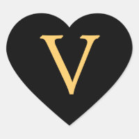 Monogram V, gold coloured initial V on black,