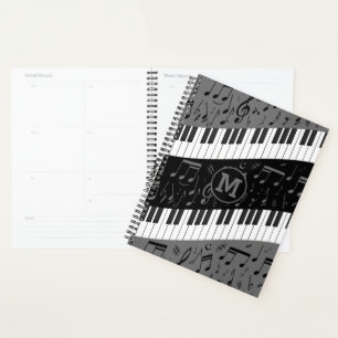 Monogrammed curve piano keys and musical notes planner