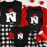 Monogrammed Family Christmas Personalise With Name T-Shirt<br><div class="desc">levate your family's holiday style with our Monogrammed Family Christmas Personalise With Name T-Shirt. These shirts are more than just festive attire; they're a symbol of your family's unique identity and unity during the holiday season. Customise each shirt with your family members' names and a distinct monogram, creating a personalised...</div>
