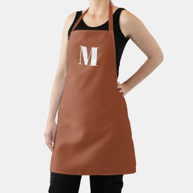 Monogrammed terracotta custom initial letter solid apron (Insitu)