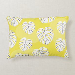 Monstera leaves, bright yellow background. decorative cushion