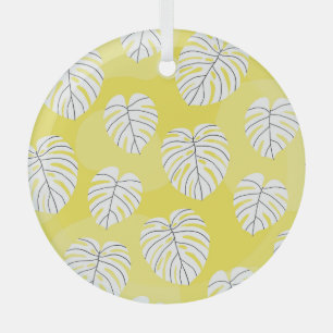 Monstera leaves, bright yellow background. glass tree decoration