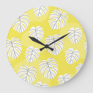Monstera leaves, bright yellow background. large clock